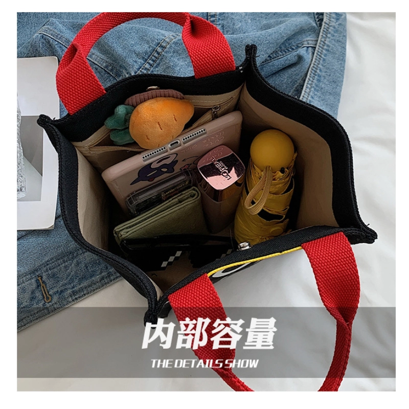 客製英倫風手提袋(黑色)紅色提把-展示內部收納的物品
